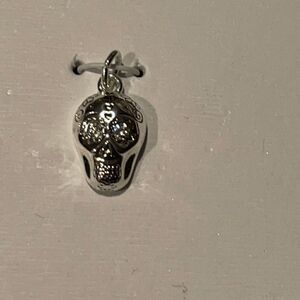 Unwritten fine silver plated skull charm